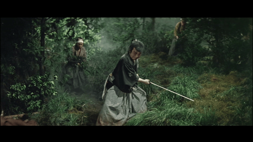 Three figures in a forest, two men in traditional garments and one man wielding a sword, creating a sense of tension in a serene natural environment.
